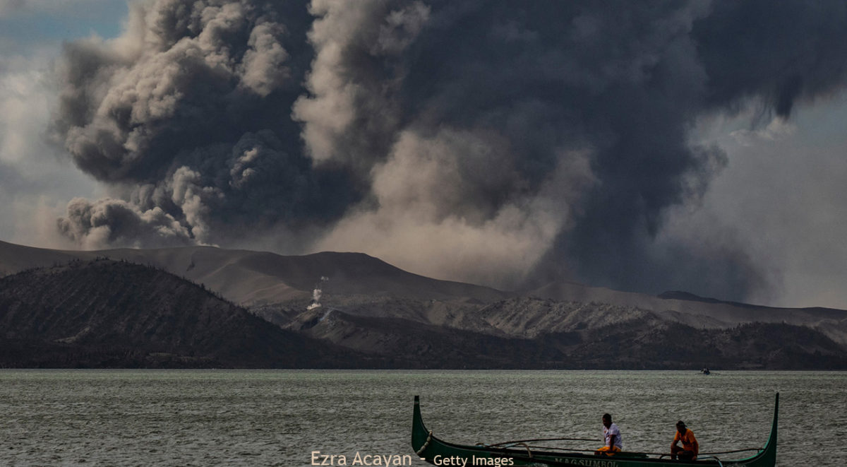 boat infront of the Taal volcano explosion